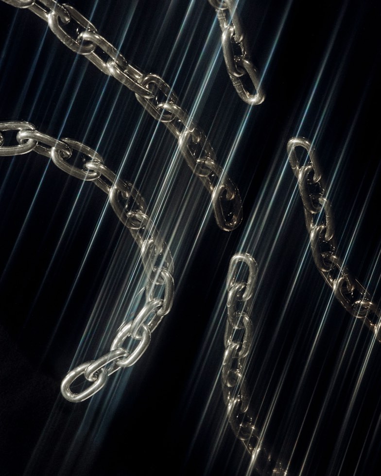 two crossed network cables on a pale background